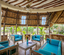 This collection of three villas is near Diani Beach. The circular villas with thatched makuti roofs are in lush tropical gardens around a swimming pool.

Green Coral Villa and Red Coral Villa have 2 bedrooms, a bathroom and a kitchen on the ground floor, and a