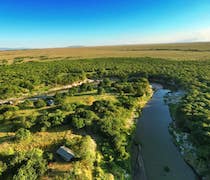 Amazing Mara Camp is a traditional safari camp on the banks of the Talek River. With views across the river into the Maasai Mara National Reserve, this mobile camp is a haven for wildlife and birdlife.

The 6 en-suite tents can be double or twin. The