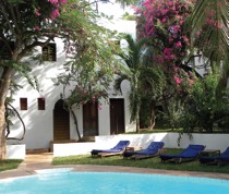 With a name meaning green in Swahili, Kijani House is a lush retreat on the beachfront of Shela. Framed by clusters of frangipani and bougainvillea, this whitewashed Swahili house recreates the atmosphere of the early days of Lamu.

There are 9 en-suite double rooms and 2 suites