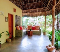 On secluded Che Shale Beach, King’s Cottage is a beach cottage in mature and spacious gardens.

There are 2 en-suite bedrooms, one double and one twin. Both have African art, woven floor mats and mosquito nets; the walls are whitewashed, with exposed beams in the