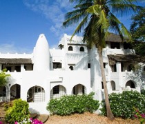 The stunning Neem House is built in traditional Swahili style, with Arabic arches, wrought iron windows and antique Lamu doors. Traditional boriti poles decorate the roofs and cool Galana stone paves the floors. The courtyard has an attractive swimming pool and the extensive rooftop offers