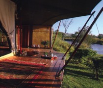 Ngare Serian is located in the Pusinkariak Conservancy, and has views of the Mara River and the towering Oloololo Escarpment. This intimate camp can be taken on an exclusive basis, and provides a true safari experience. It is accessed by a rope bridge over the