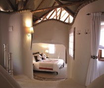 Nestling in the contours of an ancient hillside, Olarro is exclusive, intimate and stylish. The lodge is on a large group ranch, formed in order to secure an intrinsic part of the greater Maasai Mara for wildlife habitat. It aims to preserve the environment and