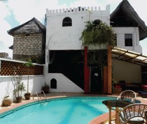 Directly opposite the jetty, Petleys is a landmark on the Lamu seafront. The tall whitewashed building has attractive rooms, a swimming pool with terrace and a glass-fronted rooftop bar with views across the sea. There are 11 en-suite rooms and a penthouse. The rooms all have