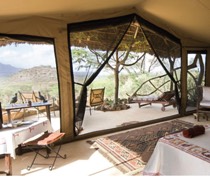 Sarara Camp, set in 850,000 acres of community conservation, has become known for luxury tented accommodation and exclusivity. The 6 spacious en-suite tents, all elegantly furnished, have been positioned to maximise the breathtaking views. Buffet lunch is served in the mess tent or under the trees. Dinner