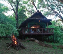 On a 30,000-acre private farm on the western edge of Tsavo West National Park, Voyager Ziwani is a tented camp. Sitting on the verge of Ziwa Dam on the Sante River, the camp looks out on the hippos that have made this their home.

There